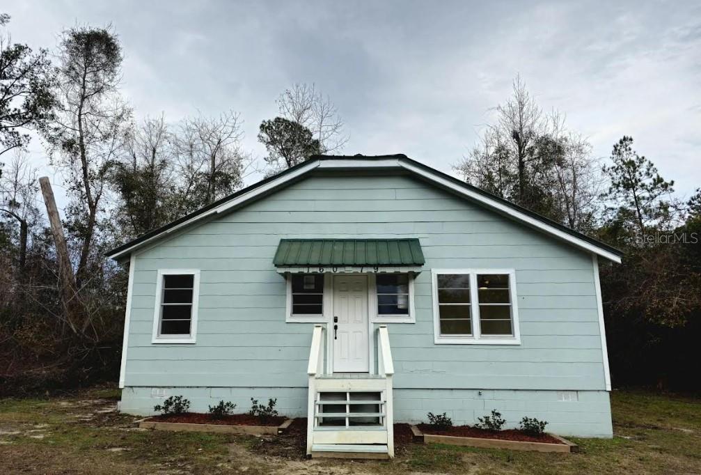 16079 SE Janet St, Blountstown, FL 32424 - back of house with crawl space and entry steps