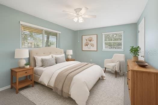 602 Park Cir, Bradenton, FL 34207 - bedroom featuring light colored carpet, baseboards, and ceiling fan