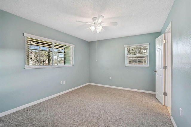 602 Park Cir, Bradenton, FL 34207 - unfurnished room with healthy amount of natural light, a ceiling fan, carpet flooring, and a textured ceiling