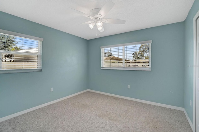 602 Park Cir, Bradenton, FL 34207 - carpeted empty room with plenty of natural light, ceiling fan, baseboards, and a textured ceiling