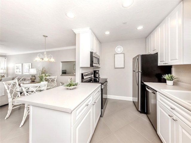 5669 Midnight Pass Rd Unit 308, Sarasota, FL 34242 - kitchen with appliances with stainless steel finishes, open floor plan, light countertops, white cabinets, and recessed lighting