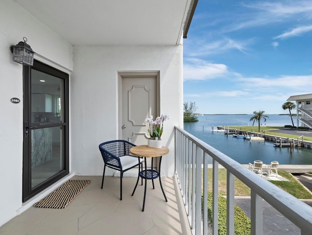 balcony featuring a water view