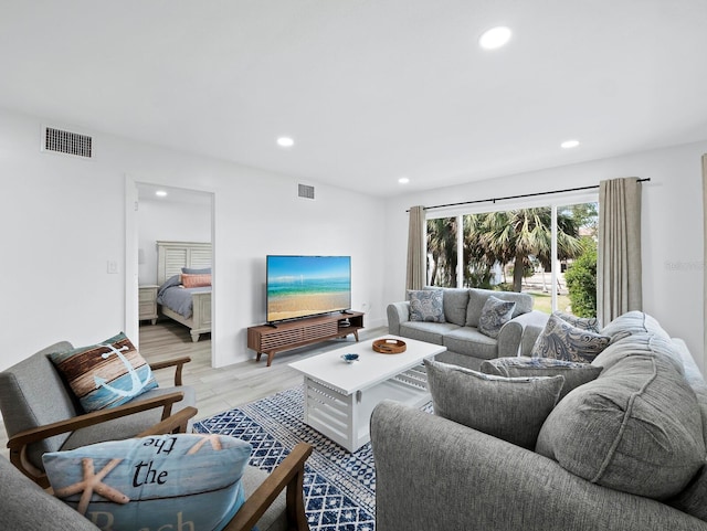 living area featuring recessed lighting and light wood-type flooring