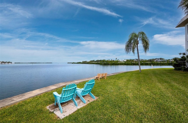 view of grassy yard with a water view