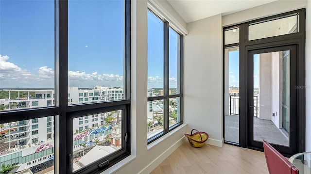 33 S Palm Ave Unit 1303, Sarasota, FL 34236 - sunroom / solarium featuring baseboards, wood finished floors, and a view of city
