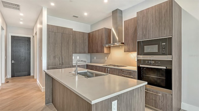 33 S Palm Ave Unit 1303, Sarasota, FL 34236 - kitchen with oven, a sink, wall chimney exhaust hood, modern cabinets, and built in microwave
