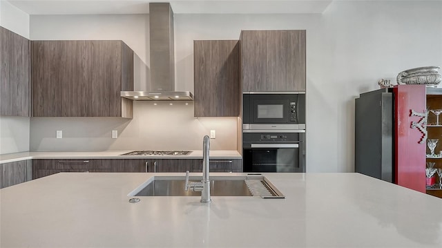 33 S Palm Ave Unit 1303, Sarasota, FL 34236 - kitchen featuring appliances with stainless steel finishes, wall chimney range hood, and modern cabinets
