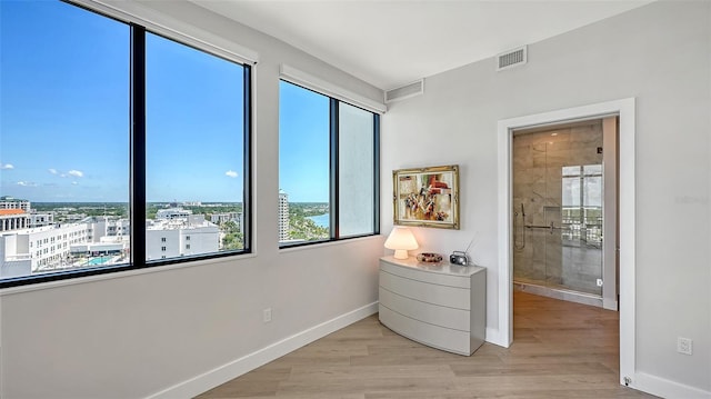33 S Palm Ave Unit 1303, Sarasota, FL 34236 - bedroom with baseboards and light wood-style floors