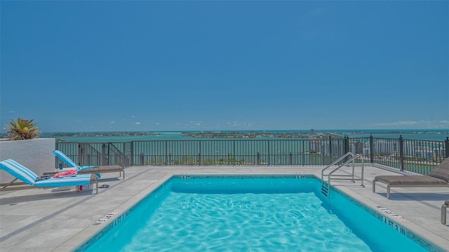 33 S Palm Ave Unit 1303, Sarasota, FL 34236 - community pool with a water view, fence, and a patio