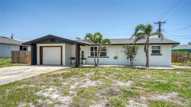 1227 Porpoise Rd, Venice, FL 34293 - ranch-style house featuring a garage and concrete driveway