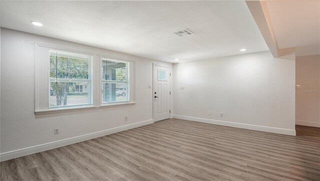 1227 Porpoise Rd, Venice, FL 34293 - foyer with wood finished floors, baseboards, and recessed lighting