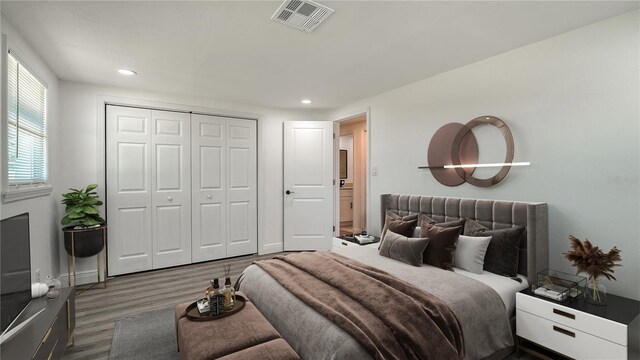 1227 Porpoise Rd, Venice, FL 34293 - bedroom featuring wood finished floors, a closet, recessed lighting, and baseboards