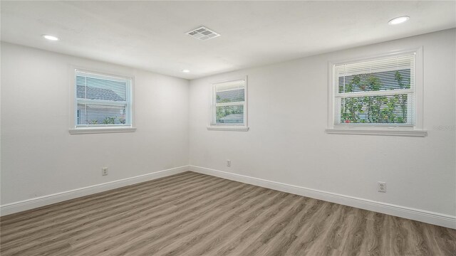 1227 Porpoise Rd, Venice, FL 34293 - spare room with light wood-type flooring, healthy amount of natural light, baseboards, and recessed lighting
