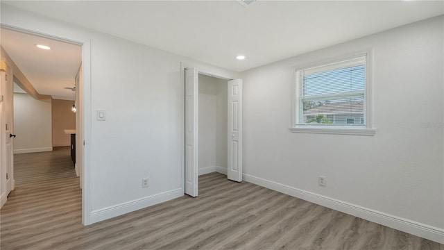 1227 Porpoise Rd, Venice, FL 34293 - unfurnished bedroom featuring light wood-style floors, baseboards, and recessed lighting