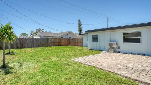 1227 Porpoise Rd, Venice, FL 34293 - view of yard featuring a patio area and a cooling unit