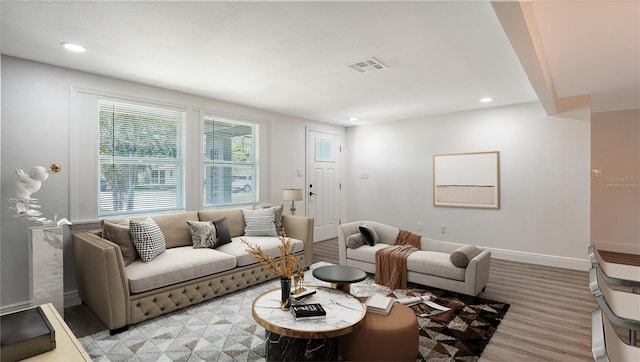 1227 Porpoise Rd, Venice, FL 34293 - living room featuring light wood-style flooring, baseboards, and recessed lighting