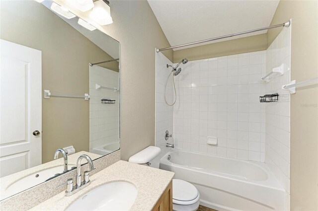 full bathroom with toilet, vanity, and  shower combination