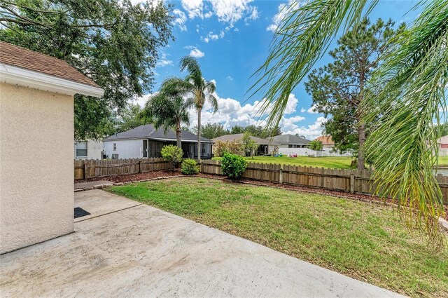 view of yard with a patio area and a residential view