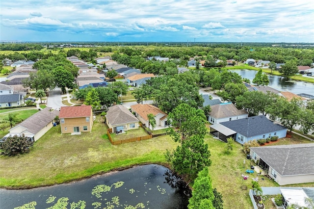 aerial view of residential area featuring a nearby body of water