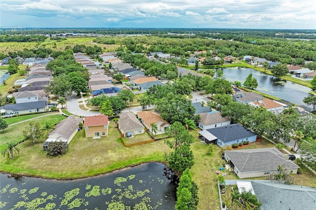 aerial perspective of suburban area with a nearby body of water