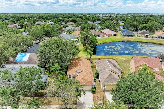 aerial perspective of suburban area with a nearby body of water