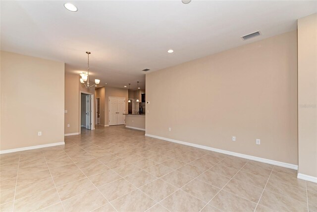 12091 Firewheel Pl, Venice, FL 34293 - unfurnished living room with recessed lighting, baseboards, and a chandelier