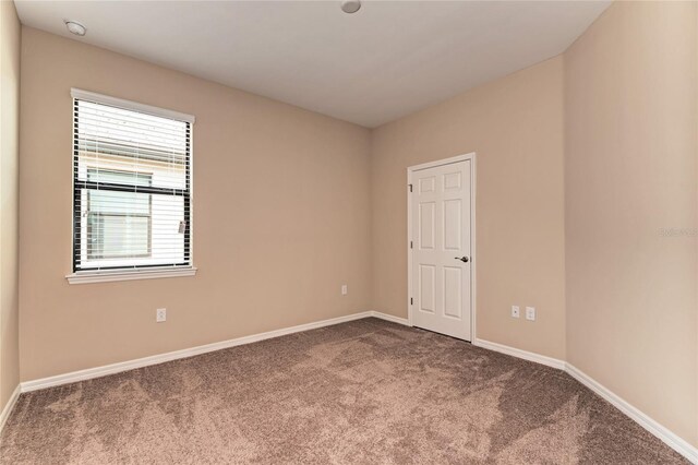 12091 Firewheel Pl, Venice, FL 34293 - spare room featuring carpet and baseboards