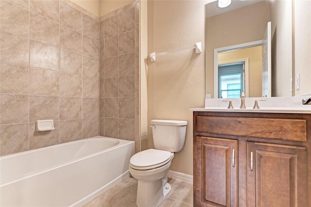 12091 Firewheel Pl, Venice, FL 34293 - full bathroom featuring toilet, vanity, tile patterned floors, baseboards, and washtub / shower combination