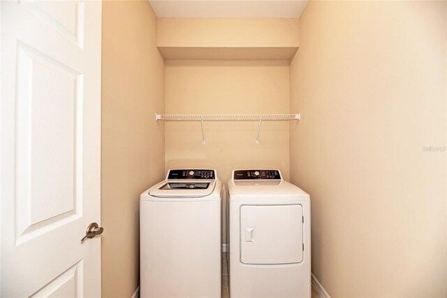12091 Firewheel Pl, Venice, FL 34293 - laundry area with washer and dryer