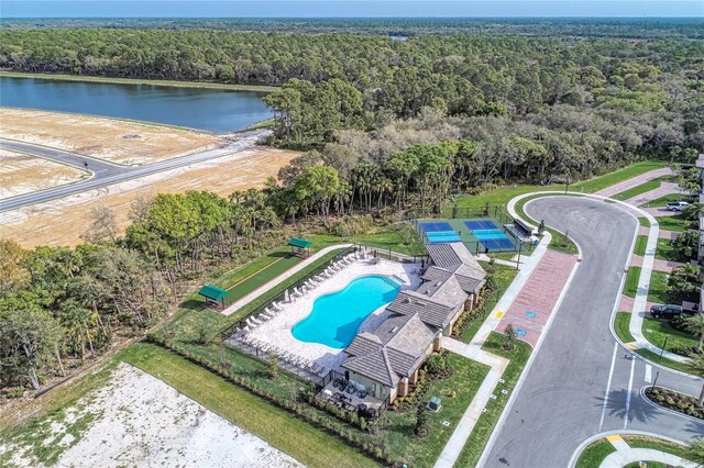 12091 Firewheel Pl, Venice, FL 34293 - drone / aerial view of a forest, a pool, and a large body of water