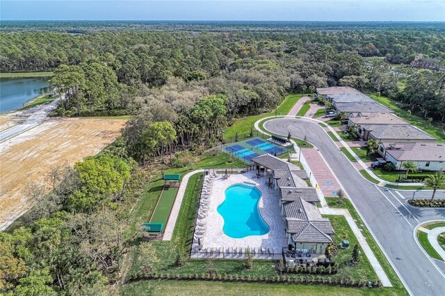 12091 Firewheel Pl, Venice, FL 34293 - drone / aerial view of a heavily wooded area and a pool area