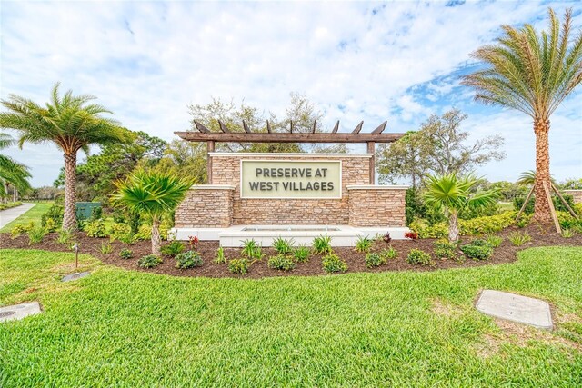 12091 Firewheel Pl, Venice, FL 34293 - community / neighborhood sign with a yard