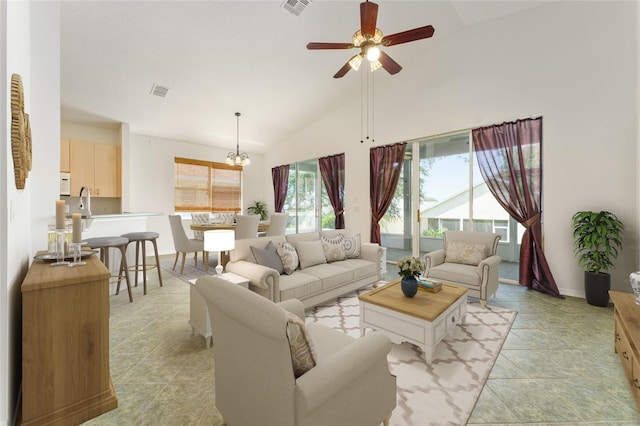777 Summit Greens Blvd, Clermont, FL 34711 - living room with a ceiling fan, a chandelier, baseboards, high vaulted ceiling, and light tile patterned floors