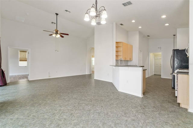 777 Summit Greens Blvd, Clermont, FL 34711 - kitchen with open shelves, high vaulted ceiling, arched walkways, open floor plan, and a ceiling fan