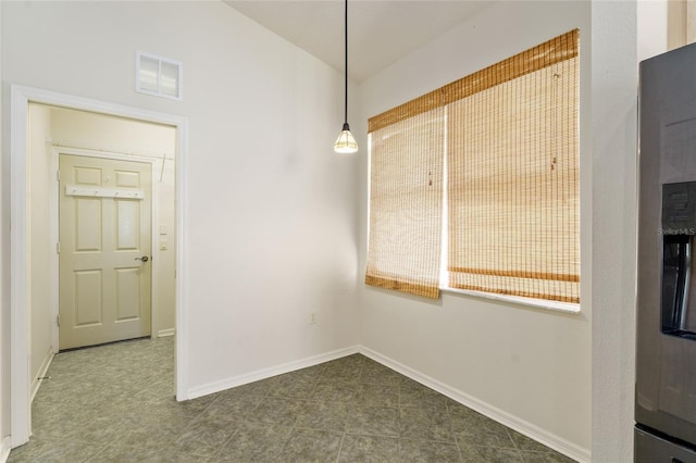 777 Summit Greens Blvd, Clermont, FL 34711 - unfurnished dining area with baseboards