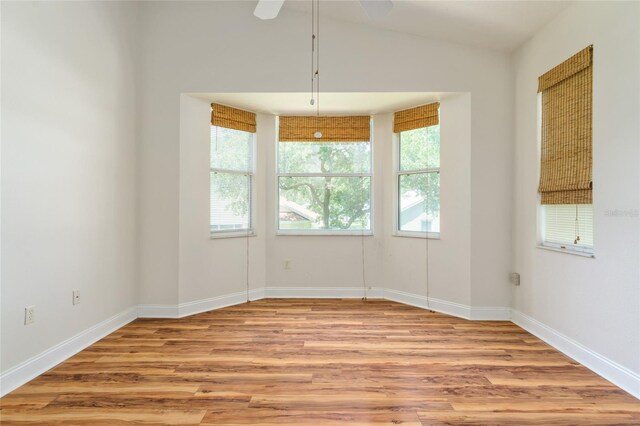 777 Summit Greens Blvd, Clermont, FL 34711 - empty room with wood finished floors, baseboards, vaulted ceiling, and a ceiling fan