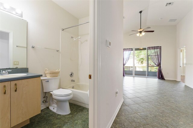 777 Summit Greens Blvd, Clermont, FL 34711 - bathroom featuring baseboards, ceiling fan, vanity, toilet, and high vaulted ceiling