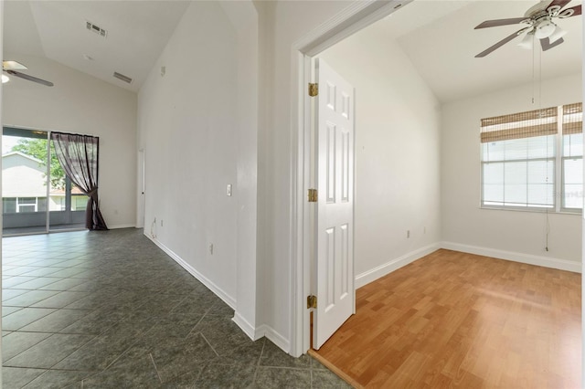 777 Summit Greens Blvd, Clermont, FL 34711 - unfurnished room featuring ceiling fan, baseboards, and high vaulted ceiling