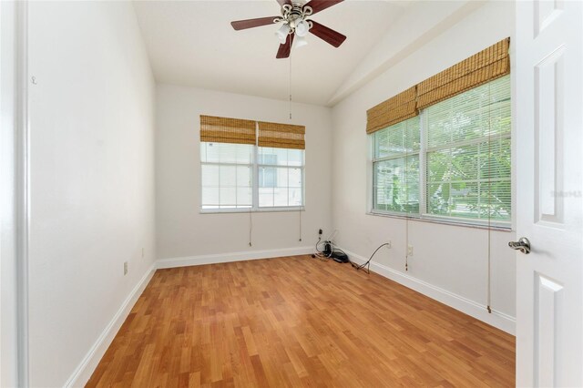 777 Summit Greens Blvd, Clermont, FL 34711 - unfurnished room with vaulted ceiling, light wood-style floors, ceiling fan, and baseboards