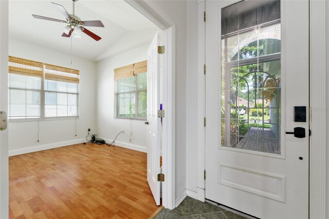 777 Summit Greens Blvd, Clermont, FL 34711 - entryway featuring vaulted ceiling, wood finished floors, a ceiling fan, and baseboards