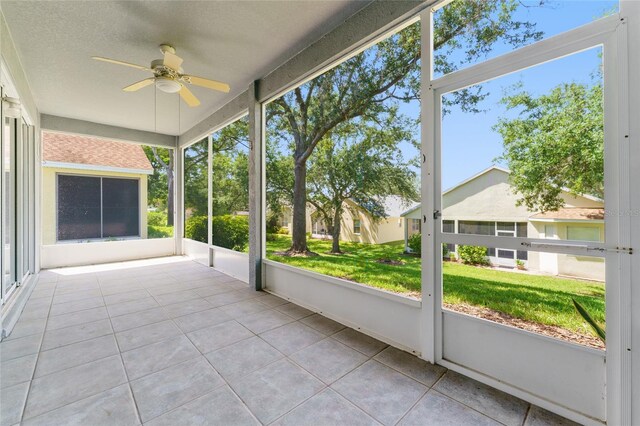 777 Summit Greens Blvd, Clermont, FL 34711 - unfurnished sunroom featuring a ceiling fan and healthy amount of natural light