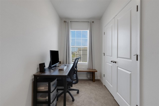 office with light colored carpet and baseboards