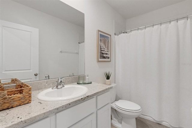 full bath featuring toilet and vanity