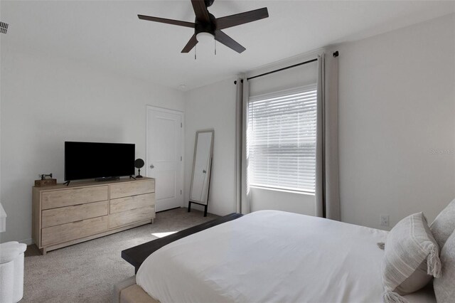 carpeted bedroom with ceiling fan