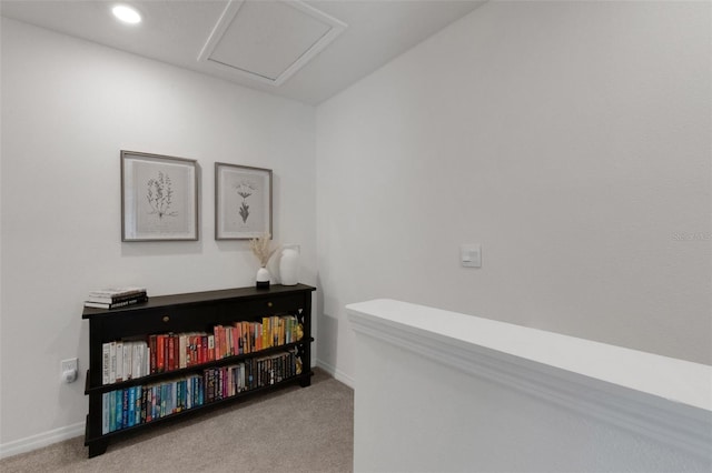 hallway featuring carpet floors, baseboards, recessed lighting, and attic access
