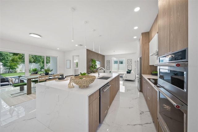 4726 Rivetta Ct, Sarasota, FL 34231 - kitchen featuring modern cabinets, stainless steel appliances, recessed lighting, a large island, and a sink