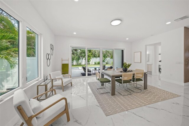 4726 Rivetta Ct, Sarasota, FL 34231 - dining room featuring light marble finish flooring, recessed lighting, and baseboards