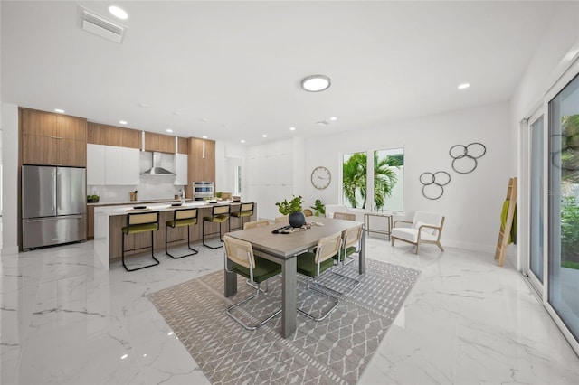 4726 Rivetta Ct, Sarasota, FL 34231 - dining area featuring light marble finish floors, healthy amount of natural light, recessed lighting, and baseboards