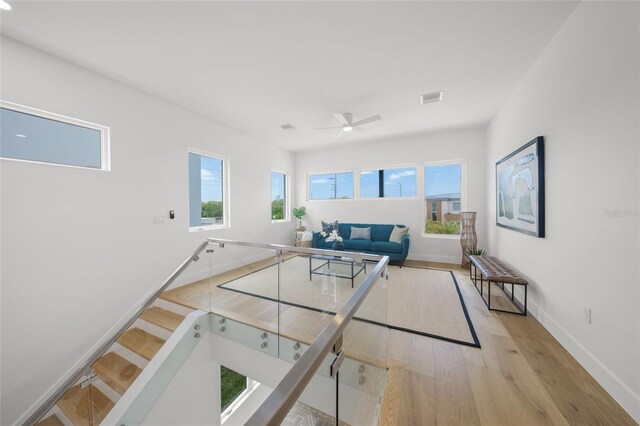 4726 Rivetta Ct, Sarasota, FL 34231 - living room featuring light wood-style flooring, baseboards, and a ceiling fan