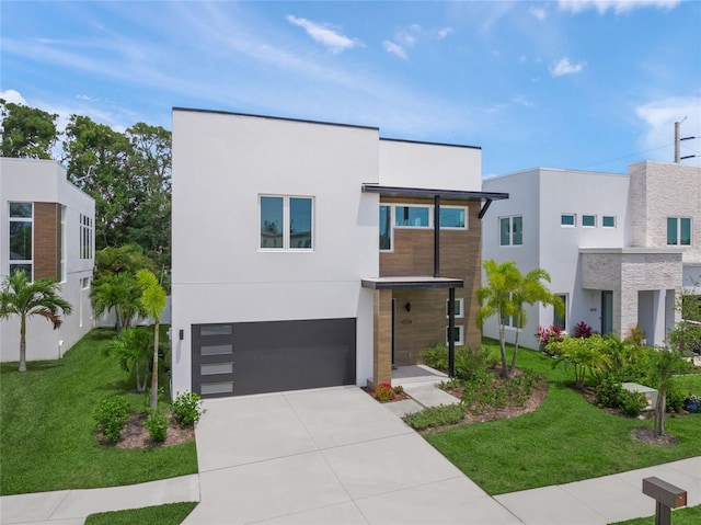 4726 Rivetta Ct, Sarasota, FL 34231 - contemporary home featuring an attached garage, concrete driveway, stucco siding, and a front yard